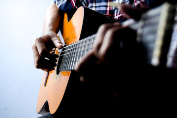 Close Up of Man's Hand Playing an Acoustic Guitar