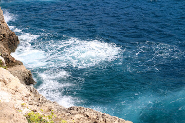 Top view of the waves breaking on the stone shore Majorca, Spain,.