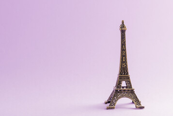 Paris France monument Eiffel tower famous landmark model, studio shot isolated on purple background