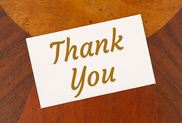 Thank you word message on white greeting card wood