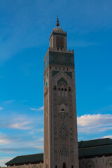 Fototapeta premium Hassan II mosque - the largest mosque of Morocco on the background of bright blue sky