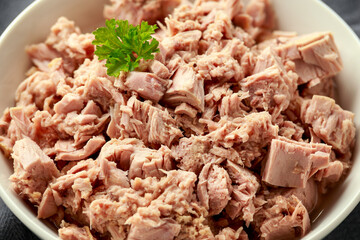 Canned tuna fish in white bowl with omega 3