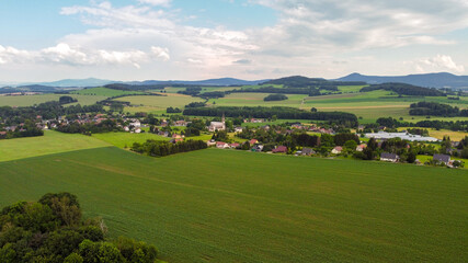 Obraz premium air view of Leutersdorf and the mountains nearby in saxony