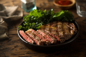 Grilled beef steak with tomato sauce