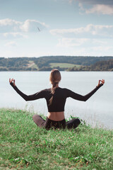 Fototapeta na wymiar woman yoga relaxing on nature