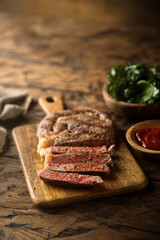Grilled beef steak with tomato sauce