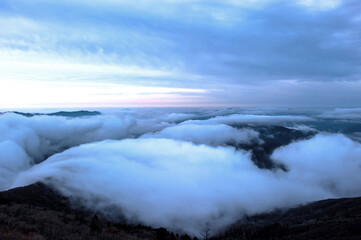 Beautiful sea of clouds at dawn on the top of the mountain.