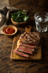 Grilled beef steak with tomato sauce