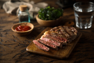 Grilled beef steak with tomato sauce