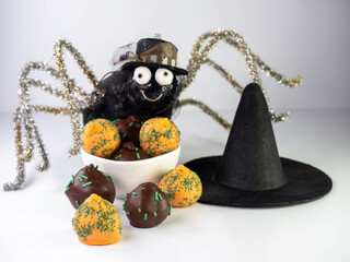 Decorative spider with large eyeballs and a smile with pipe clea