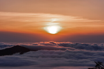 Beautiful sea of clouds at sunset on the top of the mountain.