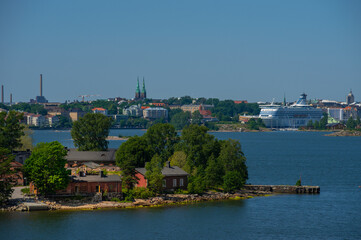 Fototapeta na wymiar View of the Lonna island and Gulf of Finland in summer. Helsinki city at background.