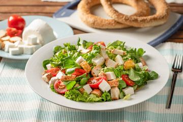 Salad with Lettuce, Iceberg, Tomato, Sesame Crouton, Rocca and Sheep Cheese