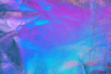 Retro holographic metallic leather background. Abstract colorful vibrant iridescent gradient. Retro...