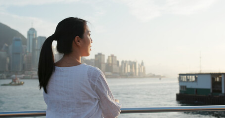 Woman looks at city in Hong Kong