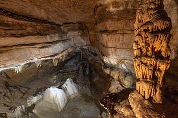 Stalagmites and stalactites in the Kalvaria hall in Krizna Jama karst cave