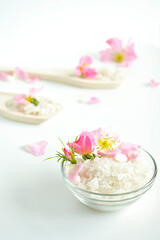 Obraz na płótnie Canvas Homemade bath salt with pink roses. Top view. Copy space.