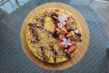 Heathy cheese cake without sugar with strawberry and cookies. Top view.