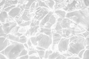 Closeup of desaturated transparent clear calm water surface texture with splashes and bubbles. Trendy abstract nature background. White-grey water waves in sunlight - obrazy, fototapety, plakaty