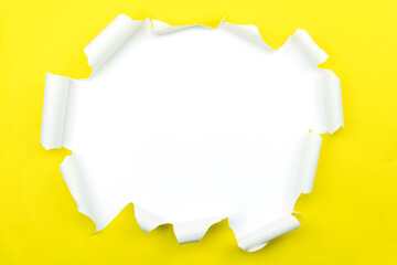Ripped open paper Yellow torn paper isolated on white background.