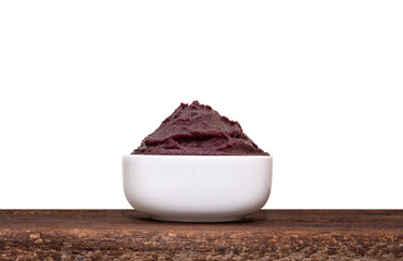 Brazilian Acai Into a Bowl on the table wooden isolated on white background