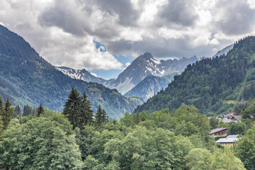 Fototapeta na wymiar Summer storm clouds building in the French Alpine village of Les Contamines-Montjoie