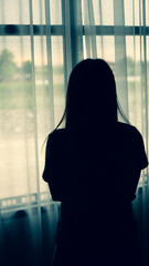 Thoughtful girl standing with looking at window, sad depressed teenager spending time alone at home, young upset pensive woman feeling lonely or frustrated thinking the problems