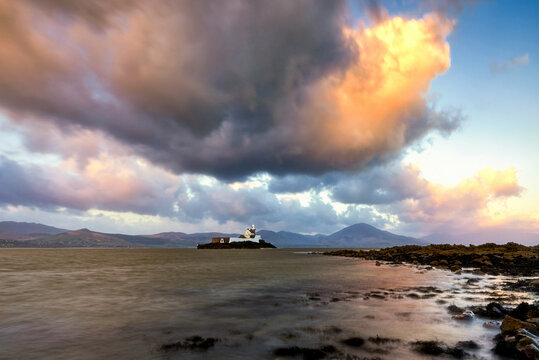 Old lighthouse, surrounded by mountains, Fenit, Ireland