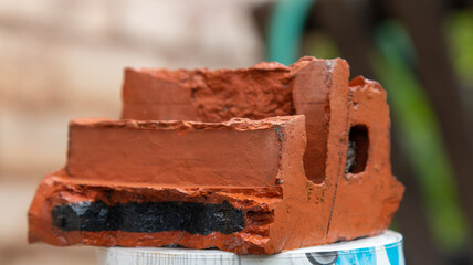 broken old red brick on the street