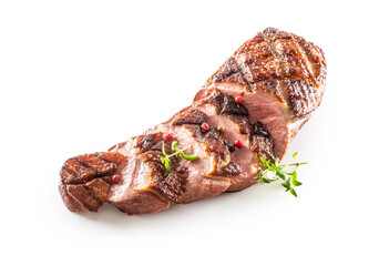 Grilled duck breast cut to slices on an isolated white background