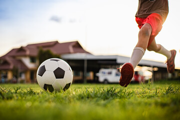 action sport picture of a group of kids playing soccer football for exercise	