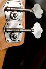 Bass guitar machine heads or tuning legs.