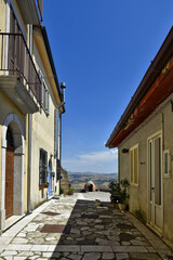 A narrow street between the houses of Cairano, a medieval town in the province of Avellino, Italy.