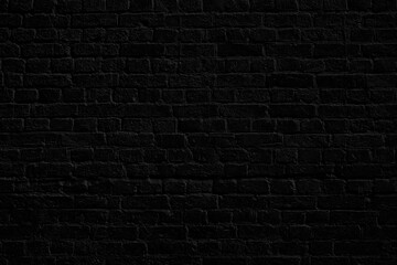 Black brick wall. Loft interior design. Black paint of the facade.