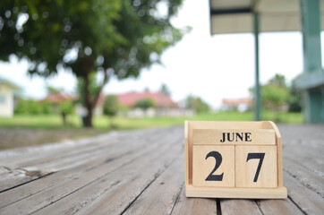 June 27, Number cube with a natural background.