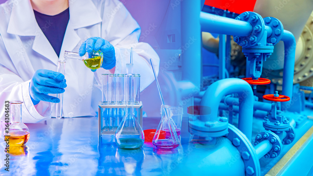 Wall mural lab technician pours liquid from a test tube. research at a chemical plant. work as a laboratory ass