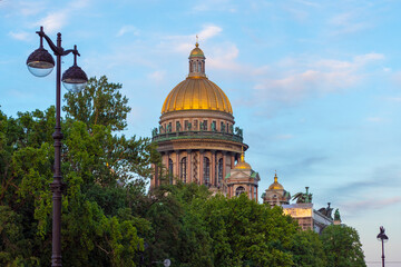 Fototapeta na wymiar Saint Petersburg. Russia. Dome of St. Isaac?s Cathedral. Golden domes of the cathedral on the background of blue sky. Church of St. Petersburg. Sights of the Russian Federation. Russia vintage.