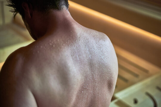 Man sweating in Finnish sauna. 