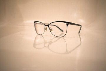 glasses with black frames on a light background