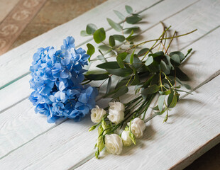 bouquet with blue hydrangea, white roses and eucalyptus