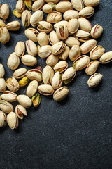 pistachios tasty nuts snack Menu concept serving size. food background top view copy space for text organic healthy eating  