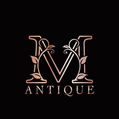 Gold Rose M Luxury Letter Logo Template Design. Monogram antique ornate nature floral leaf with initial letter logo gold rose color