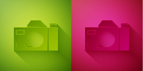Paper cut Photo camera icon isolated on green and pink background. Foto camera icon. Paper art style. Vector.