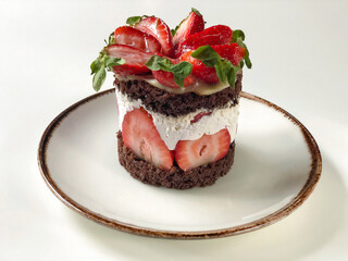 strawberry and chocolate cake on a table