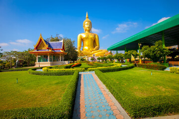 Beautiful of Large golden sitting Buddha statue with background of blue sky at Wat Muang  temple ,Ang Thaong,Thailand