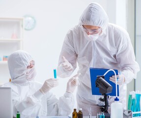 Two scientists working in the chemical lab