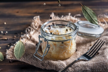 fermented vegetables on wooden background. Sauerkraut. carrots