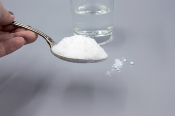 Transparent glass glass with water and white sorbent powder for treatment, ingestion for poisoning, allergies