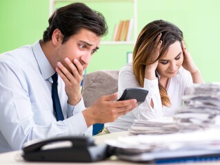 Two financial specialists working in the office