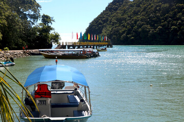 Naklejka premium tourist attraction boat is park at bay of sea